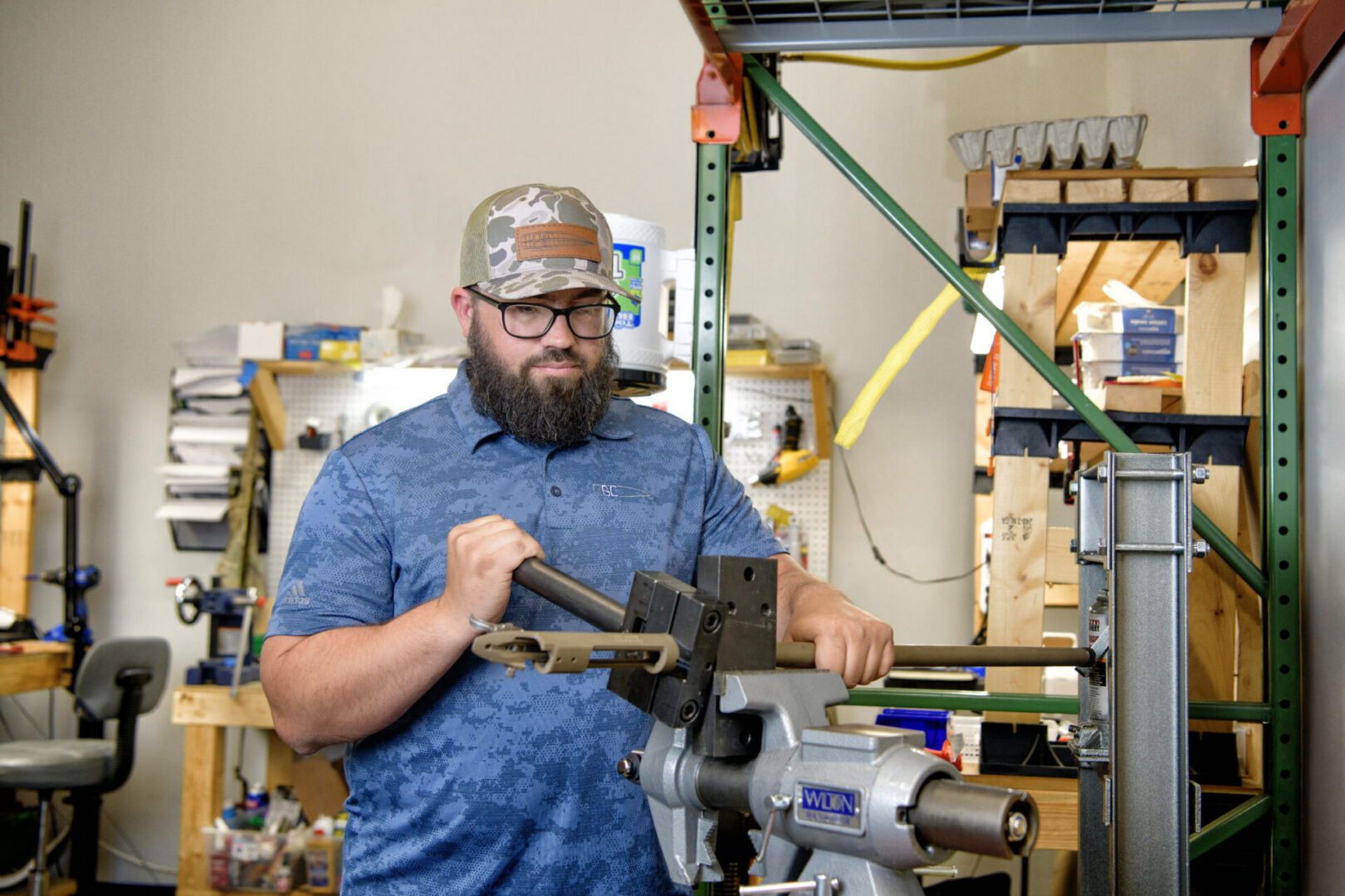 Firearms Development Technician Ethan Hayes fitting and assembling a prototype firearm component